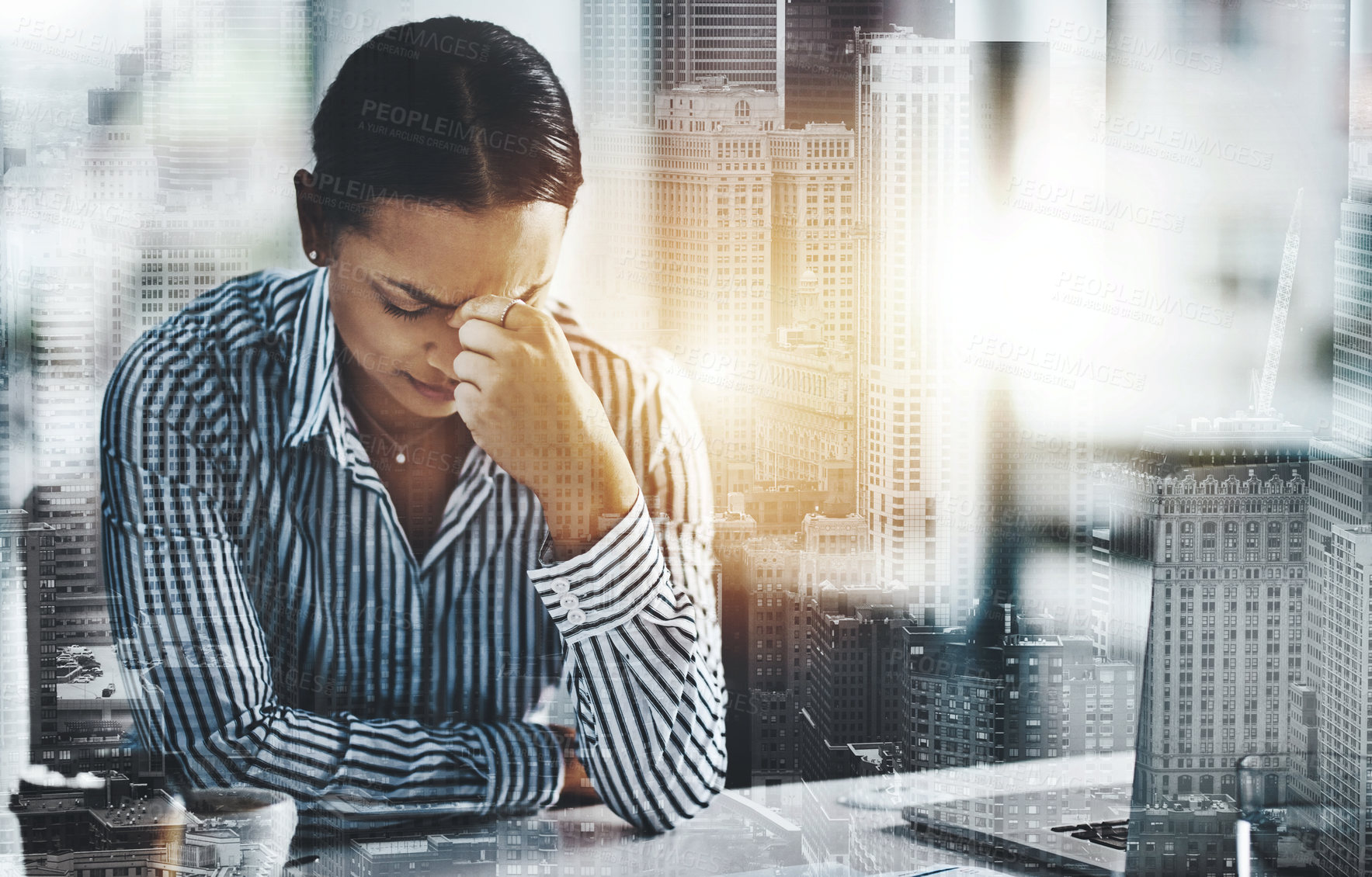 Buy stock photo Headache, pain and business woman at desk for fatigue, stress or project deadline in office. City overlay, lens flare and employee for crisis, burnout or productivity problem at architecture agency