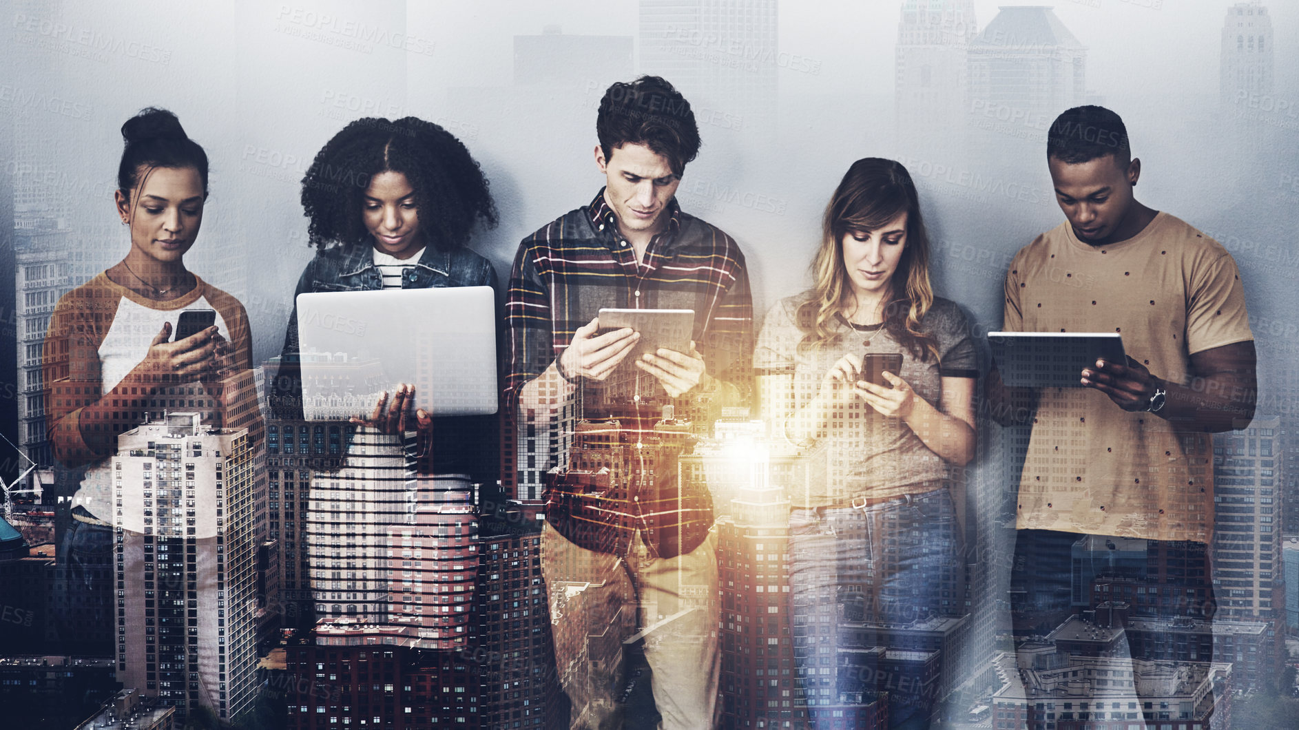 Buy stock photo Studio shot of a group of young people using wireless technology against a gray background