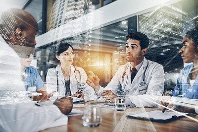 Buy stock photo Cropped shot of a group of doctors having a meeting in a hospital