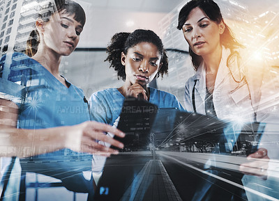 Buy stock photo Cropped shot of a group of doctors discussing the results of an X-ray in a hospital