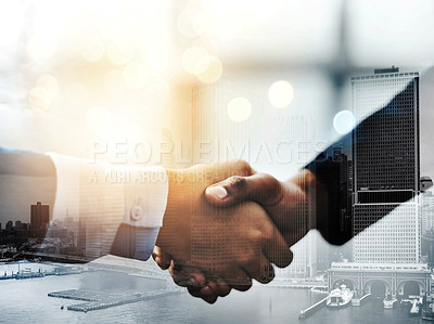 Buy stock photo Closeup shot of two unrecognizable businesspeople shaking hands in an office