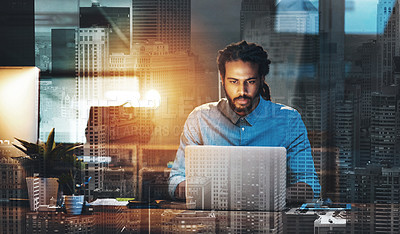 Buy stock photo Cropped shot of a young designer working late on a laptop in an office