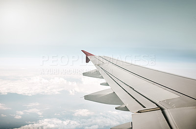 Buy stock photo Cropped shot of an aeroplane's wing while flying