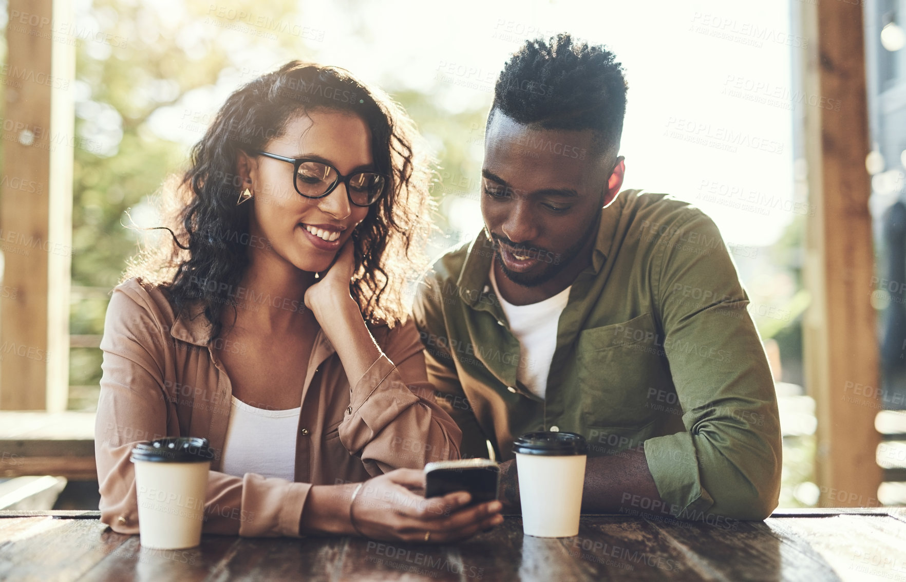 Buy stock photo Scroll, man and woman in cafe with phone, smile and connection for online dating relationship. Flirt, love and happy couple in coffee shop together with mobile app for contact, romance and networking