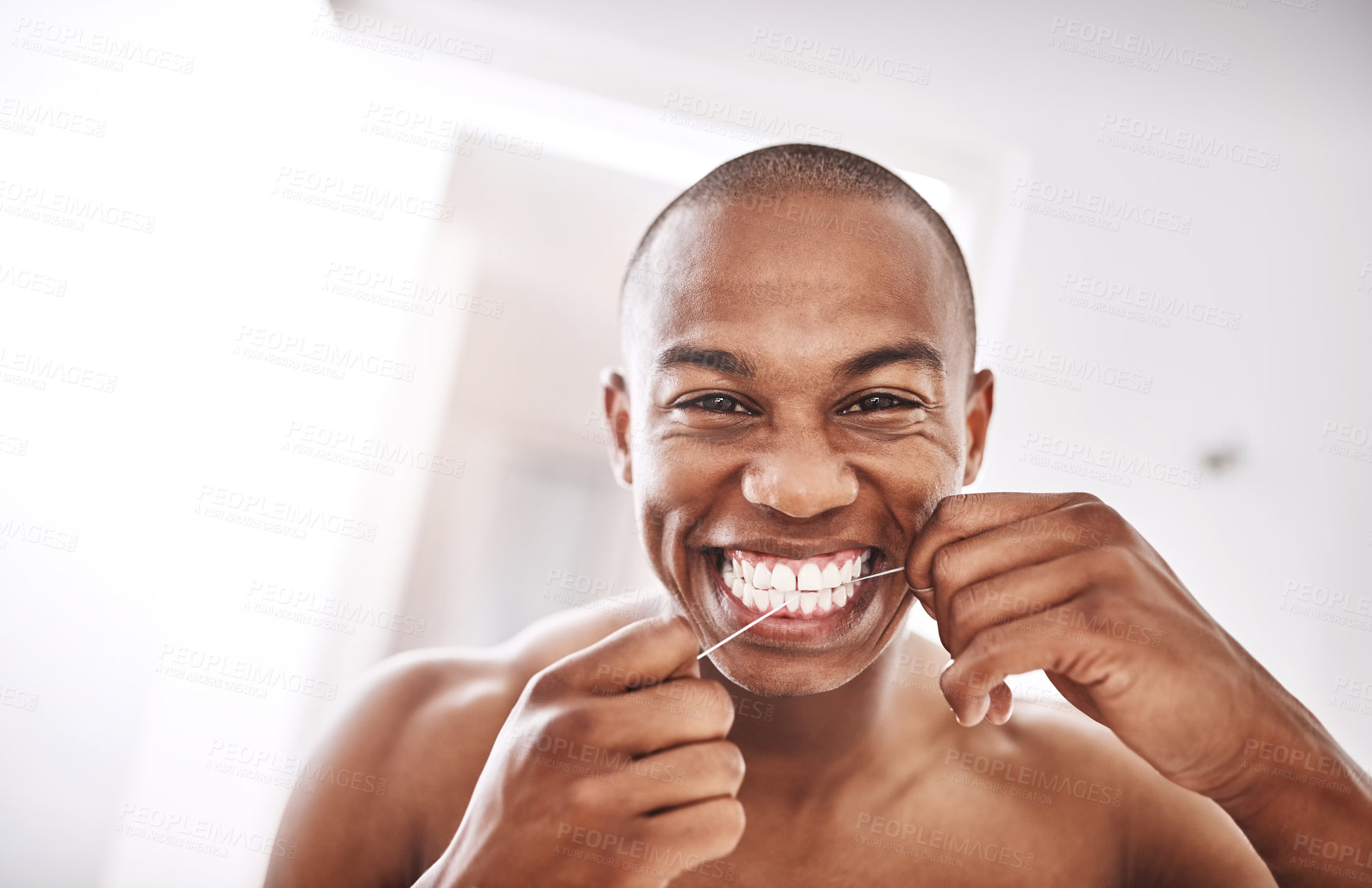 Buy stock photo Portrait, African man and floss teeth for dental hygiene, wellness or morning routine. Face, tooth and happy person cleaning with string for oral health, orthodontics or fresh breath in home bathroom