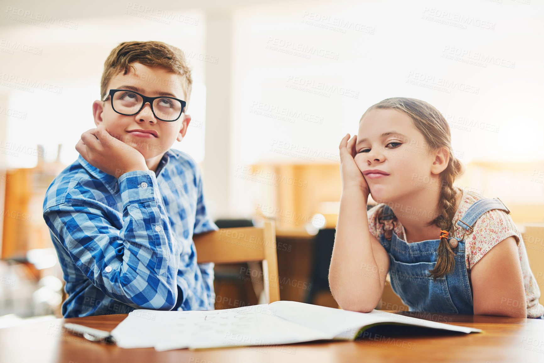 Buy stock photo Bored, notebook and portrait of children in classroom with low motivation, fatigue and lazy for learning. Education, tired and kid students with adhd in lesson at elementary school together for study