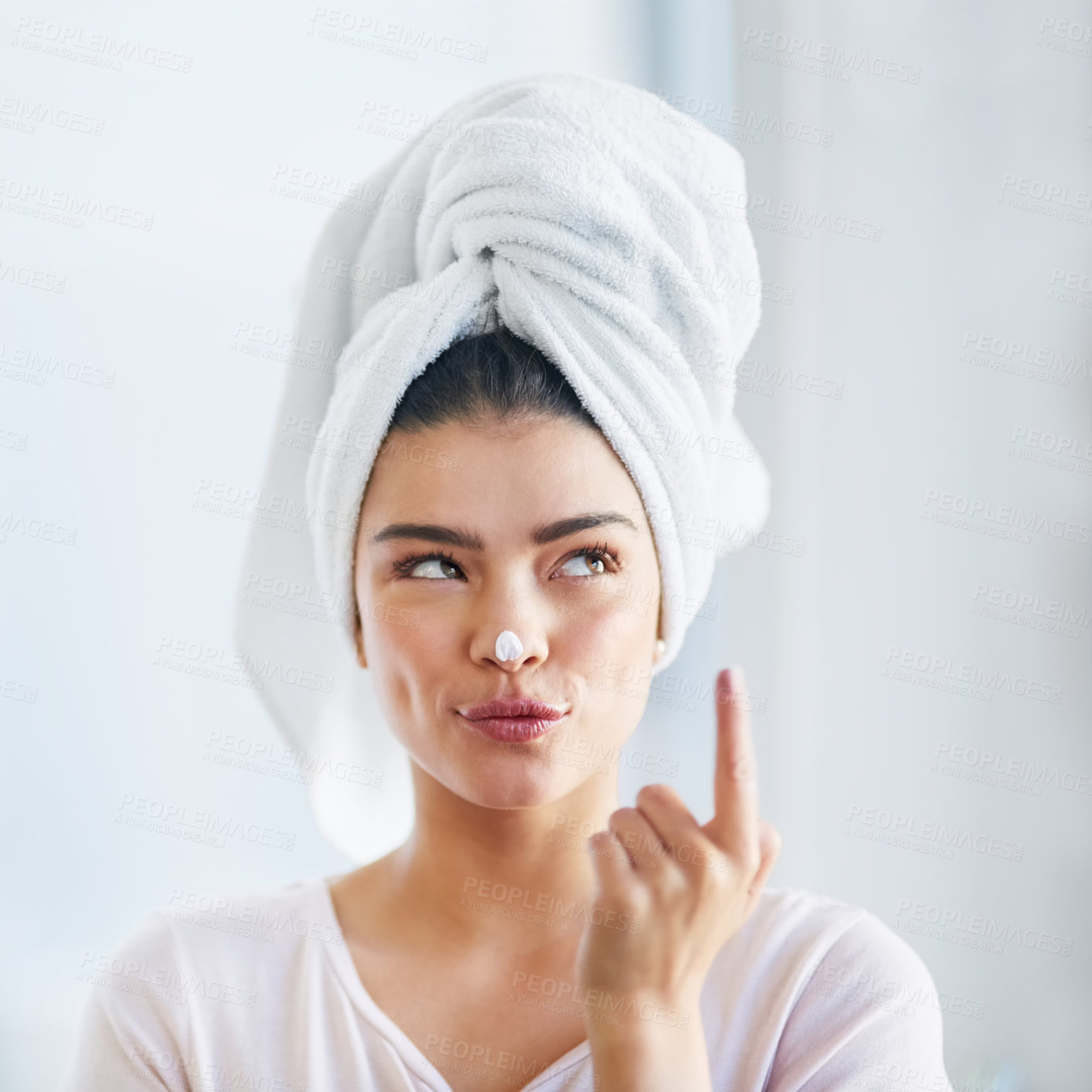 Buy stock photo Beauty, idea and lotion with face of woman in bathroom of home for morning skincare routine. Cream, finger and nose with person thinking in towel at apartment for antiaging cosmetics or dermatology