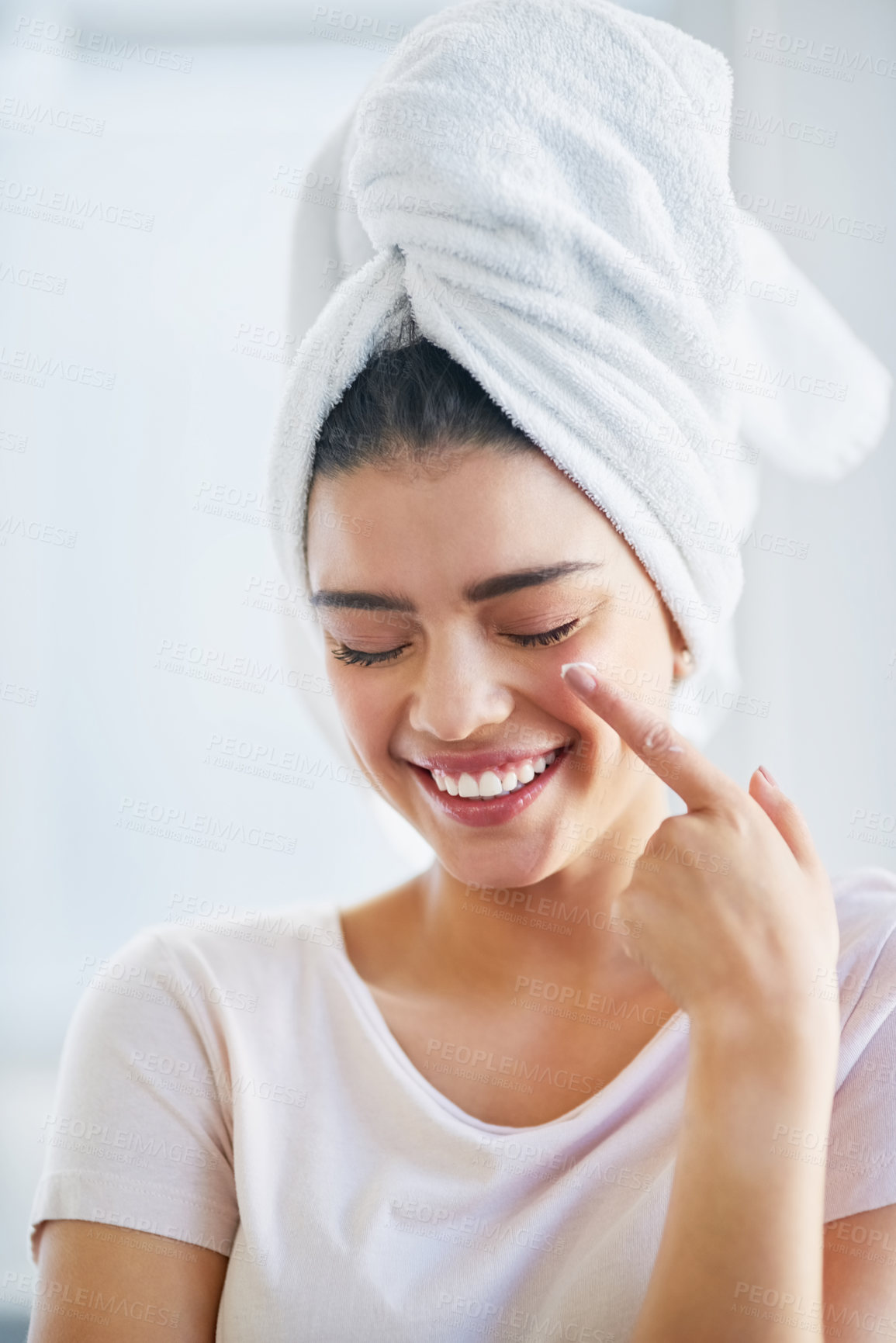 Buy stock photo Girl, calm and cream on finger for skincare with hyaluronic acid, collagen and moisturizer for skin tone or hydration. Towel, eyes closed and sunscreen with anti aging, smooth and home with cosmetics