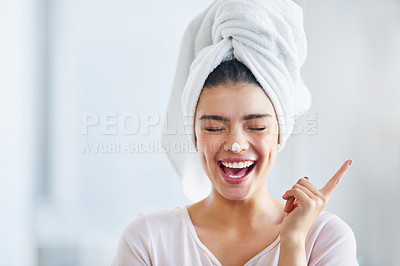 Buy stock photo Happy woman, head towel and cream on nose for cosmetics, beauty and dermatology. Female person, face and laughing with facial lotion after shower for healthy shine, glow or aesthetic skincare at home