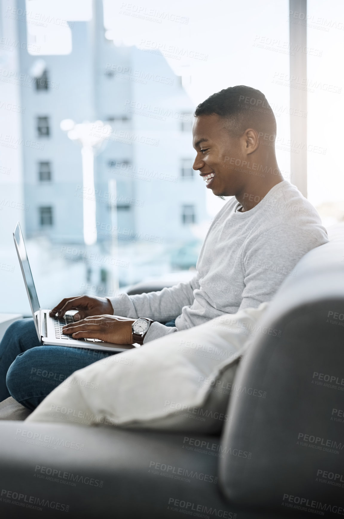 Buy stock photo Man, happy and laptop in home on sofa, networking and social media for online streaming in living room. Smile, research and technology website, remote work and internet blog or elearning in apartment