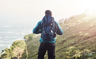 Buy stock photo Backpack, hiking and mountain with man, nature and sunshine with environment, wellness and training. Rear view, hiker and person with hiking, healthy and travel with adventure, journey and vacation