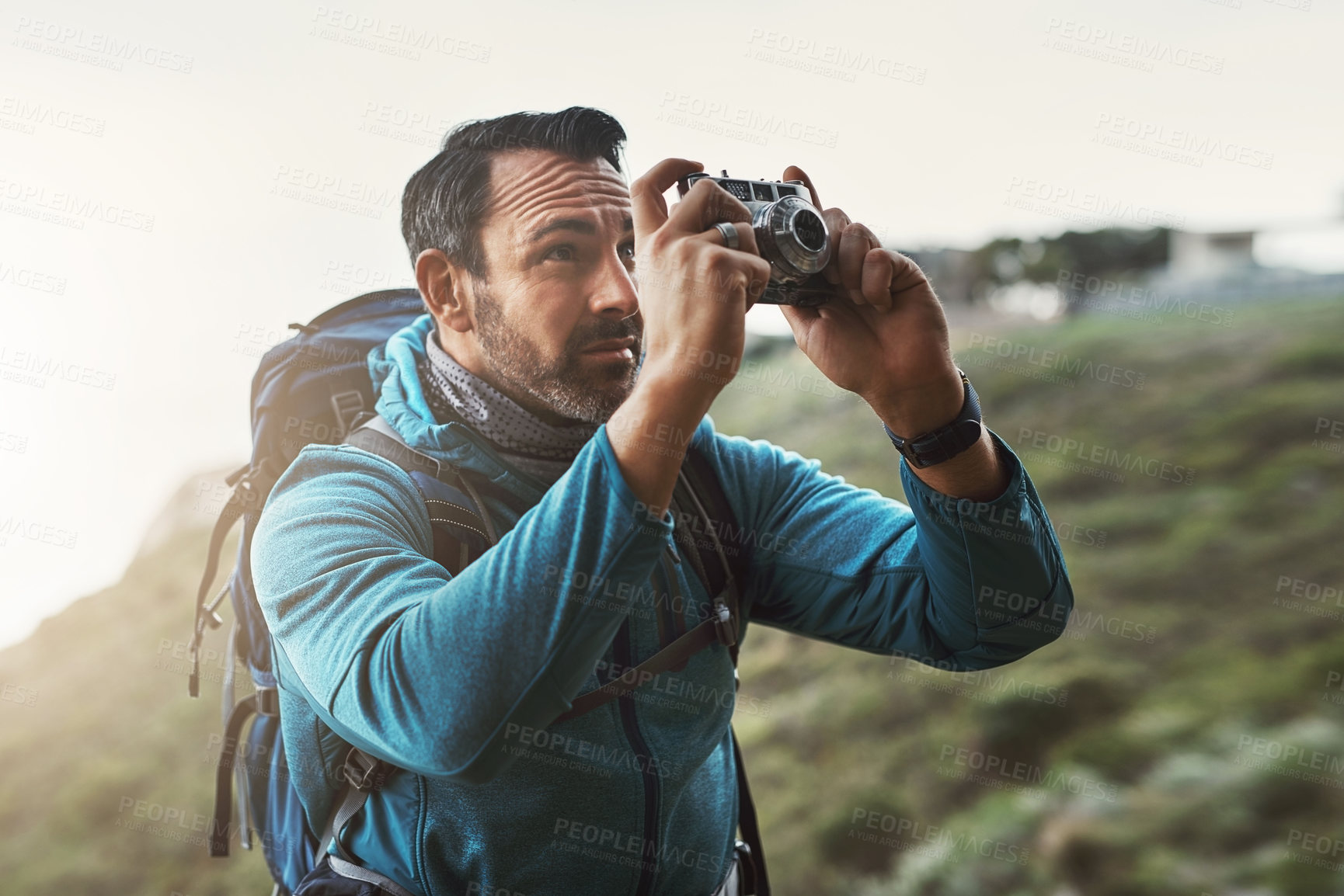 Buy stock photo Forest, photography and mature man with camera in nature for travel, hiking or journey memory. Jungle, backpack and serious wildlife photographer with digital lens for adventure, explore or discovery