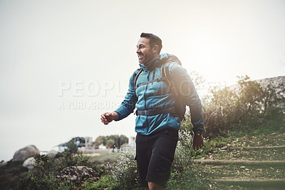 Buy stock photo Hiking, nature and man on mountain walking with backpack for adventure, trekking and freedom. Travel, fitness and person outdoors for wellness, fresh air and exercise on holiday, journey or vacation