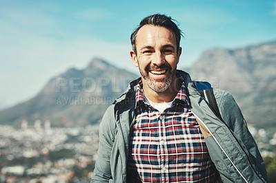 Buy stock photo Portrait of a middle aged man smiling in front of a mountain landscape