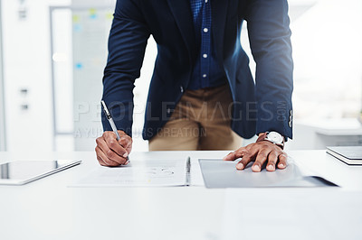 Buy stock photo Workplace, professional and writing man with paperwork at a desk with a tablet for website on app. Entrepreneur, businessman and working on documents with expert for analysis and planning in company.