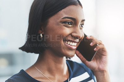 Buy stock photo Close up shot of a young businesswoman making phone calls in her office