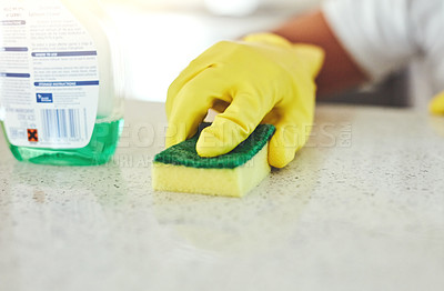 Buy stock photo Cropped shot of an unrecognizable man cleaning his kitchen at home