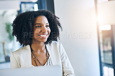 Buy stock photo Shot of a young businesswoman smiling and in good spirits at her office desk
