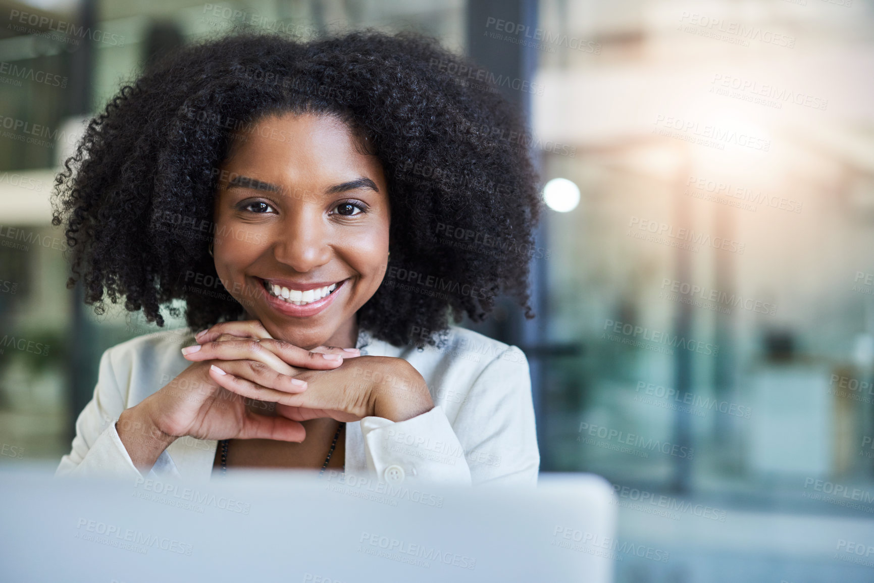 Buy stock photo Portrait of a young businesswoman smiling and in good spirits at her office desk