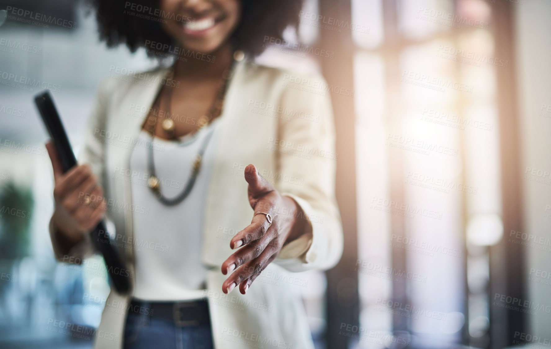 Buy stock photo Shot of an unrecognizable businesswoman reaching out for a handshake
