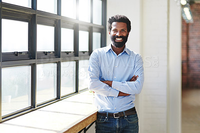 Buy stock photo Portrait, window and smile with a business man arms crossed in the office, feeling positive about future success. Mindset, vision and happy with a male employee standing at work during his break