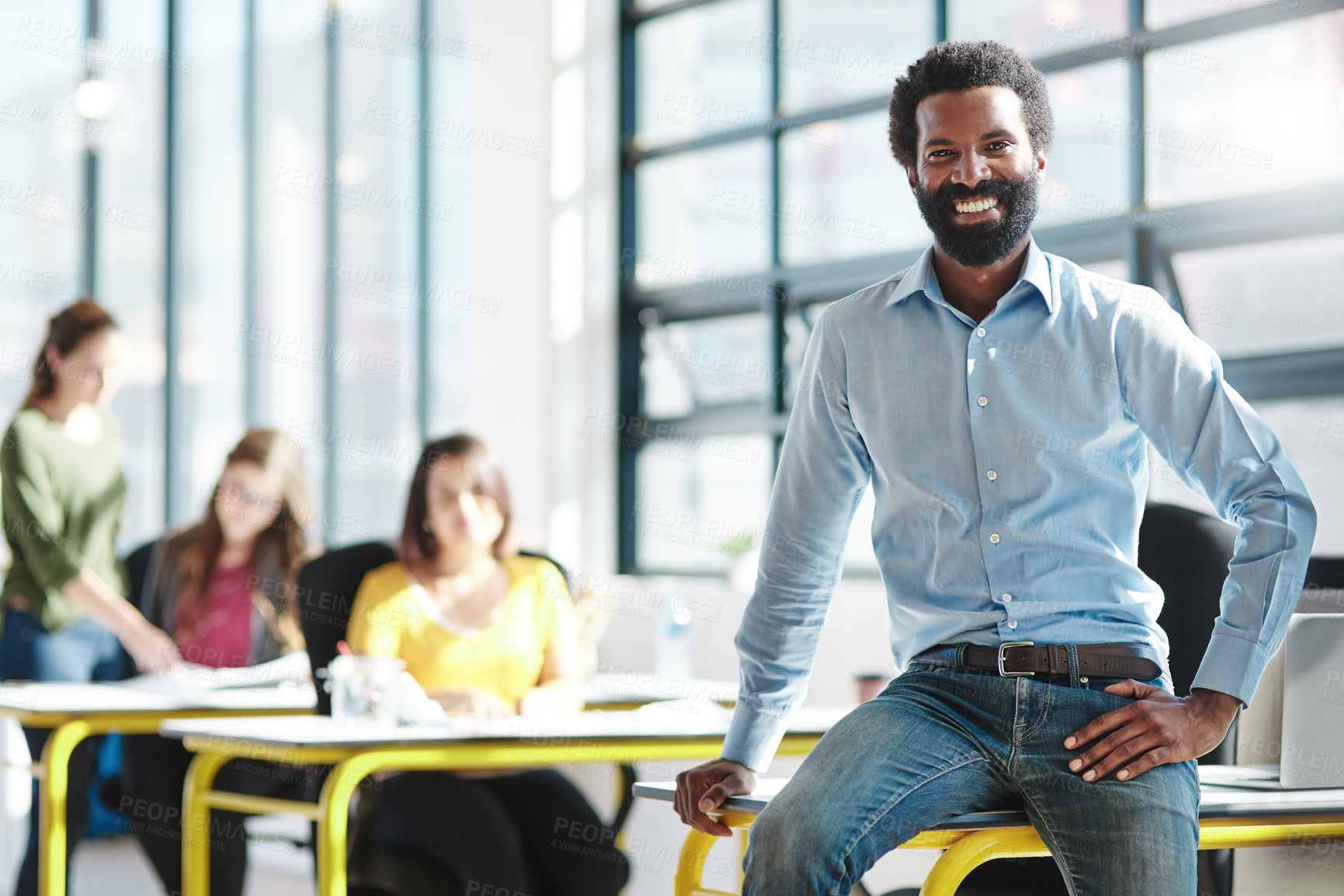 Buy stock photo Cropped portrait of a businessman in an office with his colleagues in the background