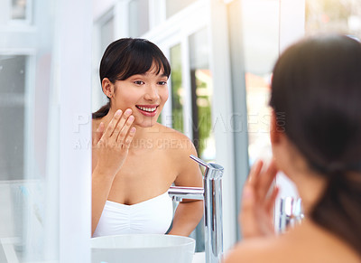 Buy stock photo Woman, happy and skincare in bathroom mirror for results, healthy skin and face products. Female person, smile and cosmetics for clear, pure and wellness in home for dermatology, clean and beauty