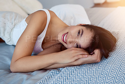 Buy stock photo Portrait, woman and smile on bed with pillow, dreaming and relax for calm body. Happy, blanket and female person in home bedroom for peaceful rest with weekend, sunshine and comfortable for health