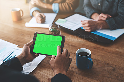 Buy stock photo Cropped shot of a businessman using a digital tablet with a green screen during a meeting at work