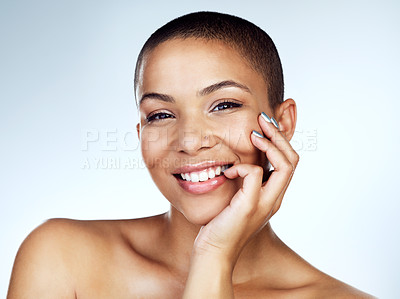 Buy stock photo Studio shot of a beautiful young woman posing with her hand on her face