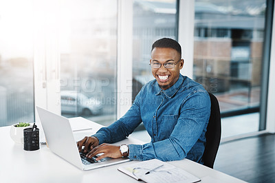 Buy stock photo Working, typing and portrait of black man by laptop in office, workspace and desk happy in creative career. Communication, internship and journalist with tech for contact, research and internet