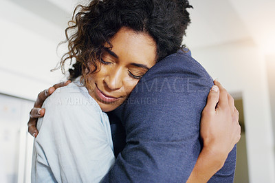 Buy stock photo Couple, hug and happy in home with love, care and connection with reunion, bonding and thinking. African woman, man and partner with embrace, smile and security in relationship for trust in apartment