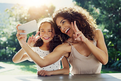 Buy stock photo Mom, girl kid and selfie in garden with peace sign, happiness or smile in summer sunshine. Young mother, daughter and profile picture for social media, app or blog in backyard with bond, love or care