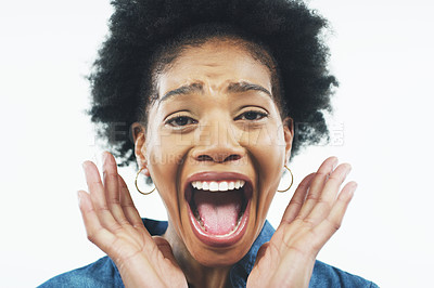 Buy stock photo Studio shot of an attractive young woman looking surprised and posing with her mouth open against a grey background