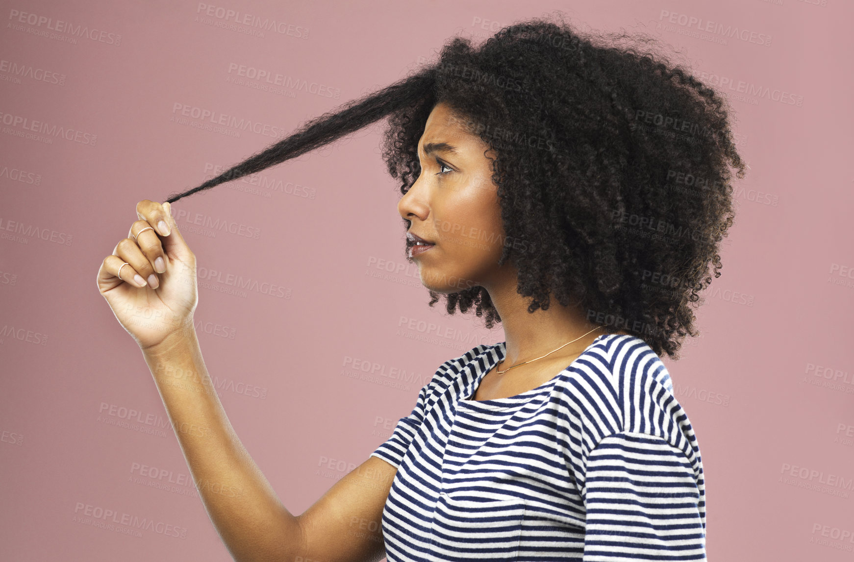 Buy stock photo Pulling hair, woman and stress with dermatology, growth and person on pink studio background. African person, model and girl with aesthetic, texture and beauty with shampoo, angry and frustrated