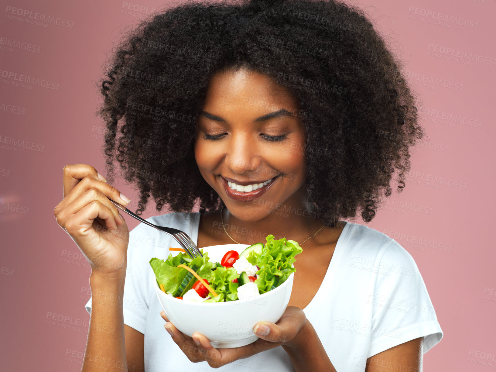 Buy stock photo Happy, eating and woman with salad for wellness, fresh and detox lunch meal with vegetables. Smile, healthy and female person enjoying nutrition, vegan and organic diet food by studio background.