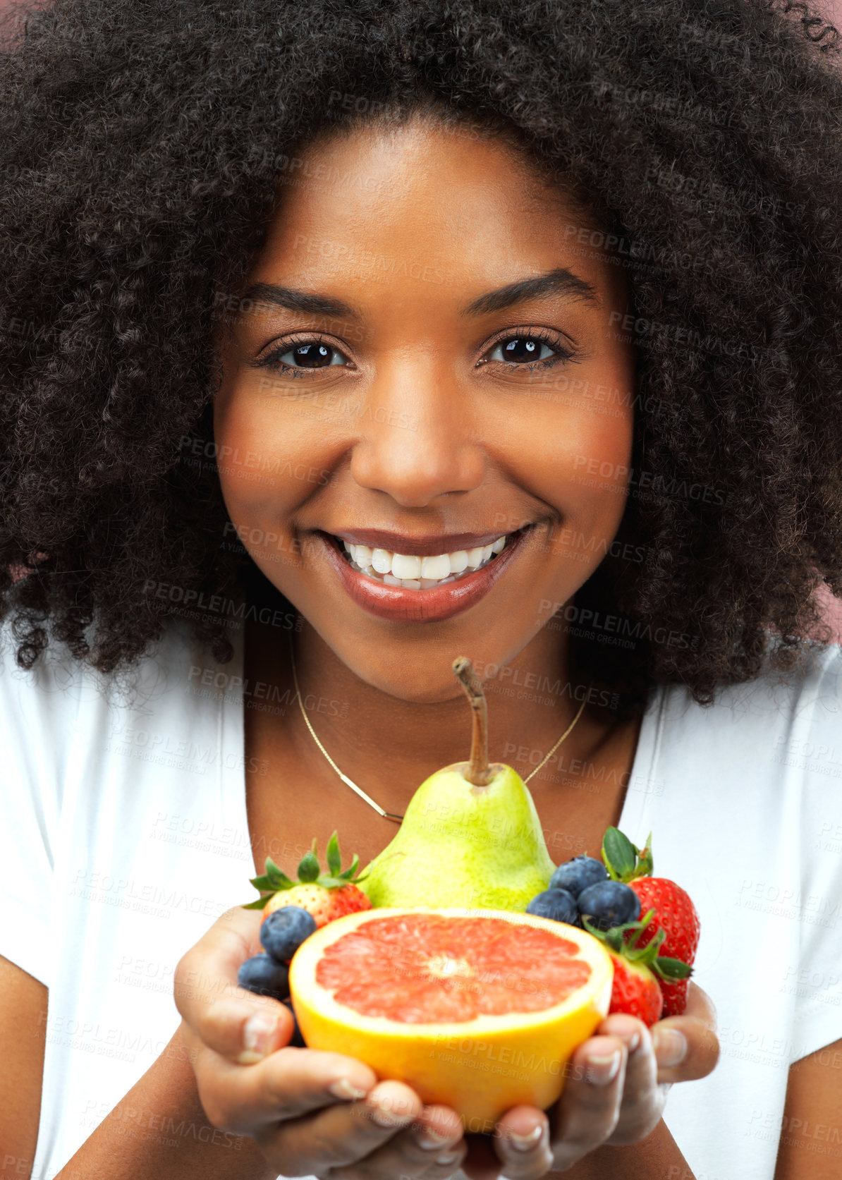 Buy stock photo Happy woman, portrait and fruit in studio for health, wellness and vegan diet in morning. Female nutritionist, food and hands with smile for nutrition, self care and vitamin intake for wellbeing