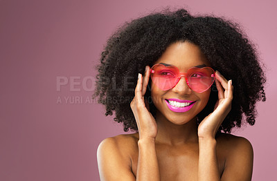 Buy stock photo Happy, woman and face with heart sunglasses and mockup space for makeup isolated on purple background. Smile, female model and comic gesture with cosmetics, lipstick and  gloss for trendy style