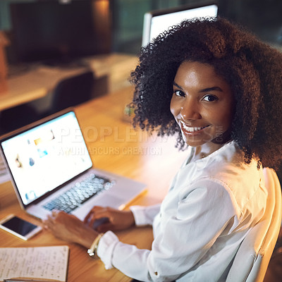 Buy stock photo Portrait of a young businesswoman working on a laptop in an office at night