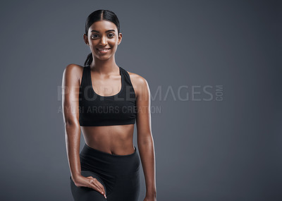 Buy stock photo Fitness, athlete and portrait of Indian woman in studio, background and happiness in mockup space. Gym, exercise and girl after workout with health, wellness and pride in training as body builder