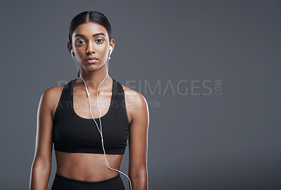 Buy stock photo Portrait, woman, and headphones in studio for music, listening and fitness by dark background. Female athlete, streaming and audio for workout, sports training and thinking of playlist on mockup 