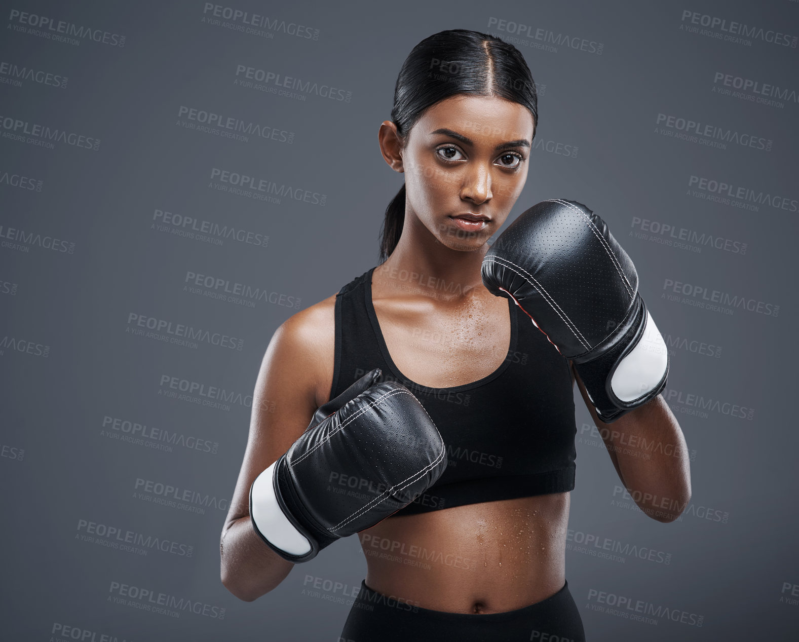 Buy stock photo Portrait, gloves and Indian woman in studio for boxing, combat and training for fitness. Self defence, boxer or mma fighter for training, workout and muay thai and cardio or impact exercise