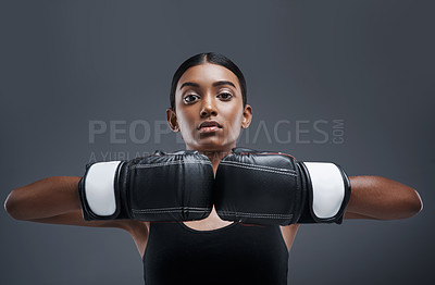 Buy stock photo Portrait, girl and boxing gloves in studio, training and sport for exercise, fitness and Indian boxer. Workout, isolated and battle or mma, strong in dark background for fight, power and challenge 