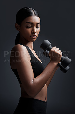 Buy stock photo Sports, serious and woman with dumbbell for workout in studio isolated on a black background. Strong, bodybuilder and Indian female athlete weightlifting for muscle, training and fitness exercise.