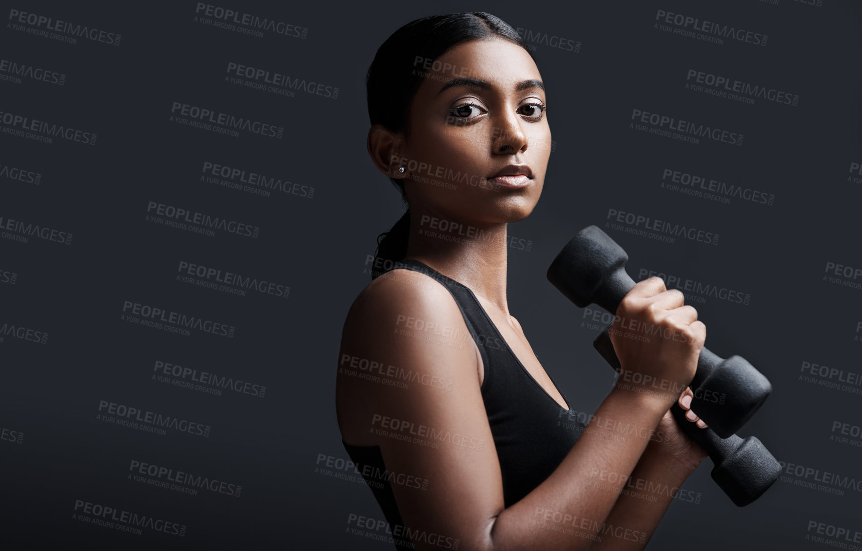 Buy stock photo Woman, portrait and dumbbells in studio for exercise training on black background for wellness, lose weight or mockup space. Female person, face and weightlifting workout or muscle, goal or confident