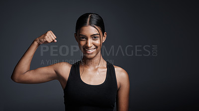 Buy stock photo Portrait, smile and woman flexing bicep in studio isolated on a black background mockup space. Strong, happy and female athlete with muscle, arm strength and bodybuilder ready for fitness workout.