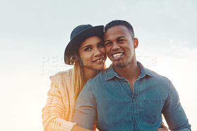 Buy stock photo Shot of a happy young couple enjoying a romantic day outdoors