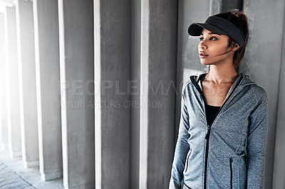 Buy stock photo Cropped shot of an attractive and athletic young woman standing outside while running in the city