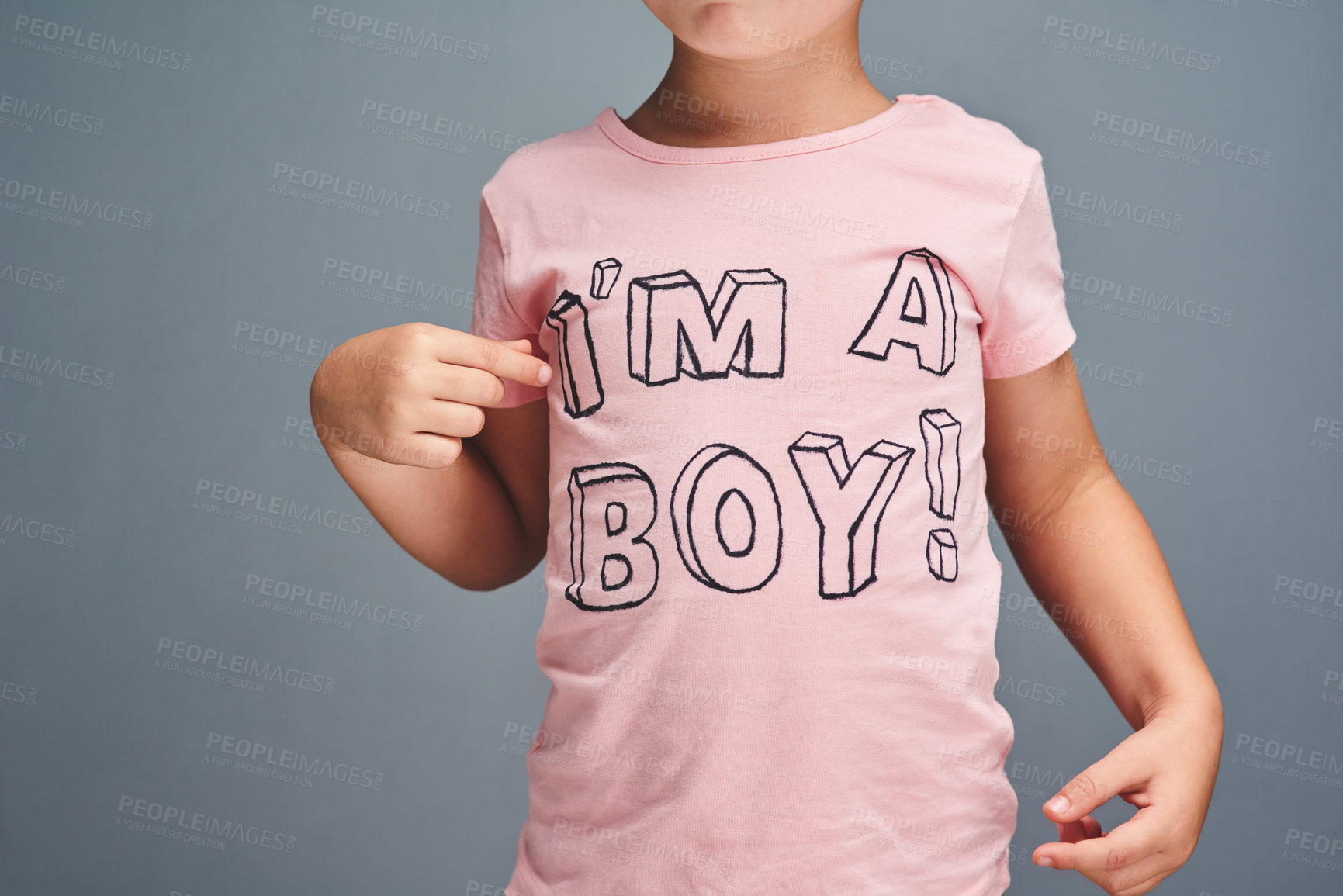 Buy stock photo Studio shot of an unrecognizable boy wearing a t shirt with “I’m a boy” printed on it against a grey background