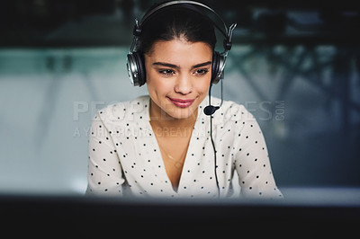 Buy stock photo Cropped shot of an attractive young businesswoman working late in a call center